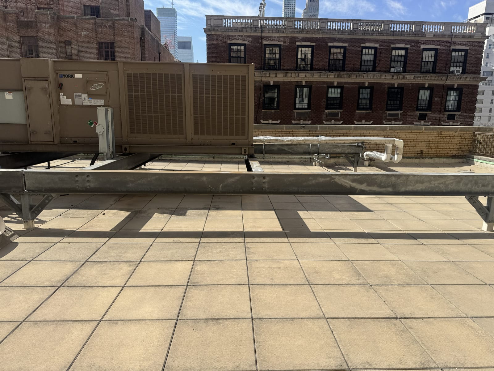 Eastern Engineering Solution rooftop HVAC commissioning on a Manhattan rooftop against the skyline
